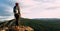 A lonely traveler with a backpack on the background of mountains, panorama. A female traveler in the mountains.