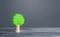 Lonely tree on gray background. Preserving the environment and forest protection. Environmentally friendly and natural. Bright