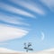 Lonely tree, snowy hills against the blue sky with clouds and moon. Winter lunar landscape in the style of minimalism.