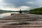 A lonely trekker on a jetty on the Saimaa lake in the Kolovesi N