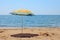 Lonely umbrella on the beach