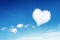 lonely white heart shaped cloud on blue sky for pattern