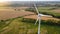 Lonely wind turbine in farm fields