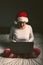 Lonely woman browsing internet on Christmas eve