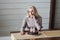 Lonely woman looking at birthday cake