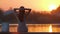 Lonely woman sitting on lake side on warm evening. Solitude and relaxation concept