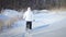 Lonely Woman Snowshoeing in nature