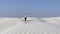 Lonely woman walking in desert