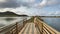 Lonely woman on a wooden bridge