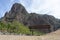 Lonely wooden bench in the mountain in relax and peaceful view point. Place to rest and calm spot with great peak and empty sea