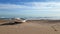 Lonely wooden boat on a sandy beach