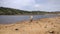 Loner on the banks of a small reservoir