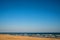 Lonesome beach of the Baltic Sea with blue sky