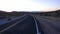 Lonesome road through Arizona desert in the evening - 4k resolution