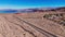 Lonesome road through the desert from above aerial view