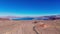 Lonesome road through the desert from above aerial view