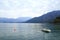 Lonesome sail boat with a red buoy in Lake Como in Italy,