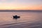 Loney motorboat at Kvarner Bucht ocean, mountain view at sunrise, croatia