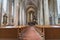 Long aisle between rows of pews to altar