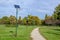 Long alley and many lighting poles activated with attached blue solar panels in Parcul Izvor Izvor Park in Bucharest, Romania,