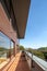 Long balcony in wooden facade building