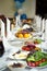 Long banquet table with fruits. Indoor