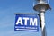 LONG BEACH, CALIFORNIA - 06-MAR 2020: ATM sign on a lamppost at Shoreline Village