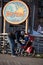 Long Beach, New York - 02/21/2018 : A man buckles in a child for a bike ride down Long Beach Boardwalk.