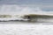 Long Beach, New York - March 3, 2018 : Surfers in Long Beach New York for the massive swells following a Winter Storm