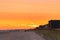 Long Beach, New York - September 21, 2020 : Vibrant sunset over the boardwalk and beach.