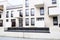 Long bench in a courtyard in modern white apartment buildings district