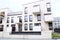 Long bench in a courtyard in modern white apartment buildings district