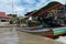 A long boat racing through the canals of Bangkok, Thailand