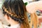 Long braid creative brown hair style in salon