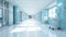 A long, bright hospital corridor with rooms and seating