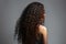 Long Brunette Afro Curls , Rear View On White Background. Generative AI