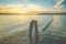 Long buoy in line in the lake when sunset