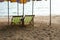 Long chairs on the beach with sunset. Pattaya, Thailand.