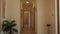 Long corridor with wooden doors