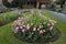 Long Curved Pink and Green Flower Bed