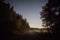 Long dirt road and starry sky at night moonlight