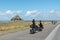 Long-distance bicycle tourists visiting and traveling to the famous Mont Saint-Michel in northern France