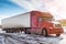 Long-distance bonnet truck with a white semitrailer in the countryside at winter