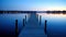 a long dock sitting in the middle of a body of water