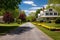 long driveway leading to a colonial revival house