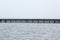 Long empty pier against sea horizon - abstract sea background