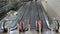Long empty running upward escalators in airport terminal