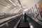 Long escalator in subway tube station