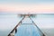 Long esposure view of a old jetty in a calm sea with gentle sky, soft colors