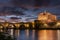 Long Exposition at Blue Hour of The Saint Angel`s Castle and a Bridge of the Tevere River Illuminated by Artificial Lights after